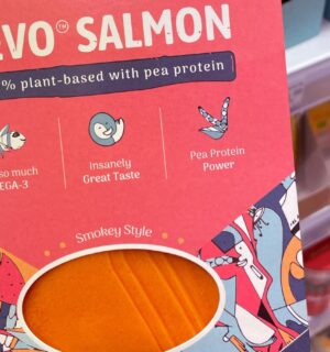 Photo shows someone holding a package of plant-based 'Revo Salmon' in the supermarket.