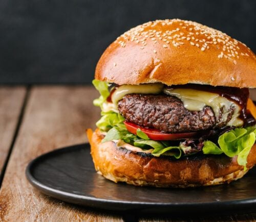A juicy vegan burger with melted dairy-free cheese