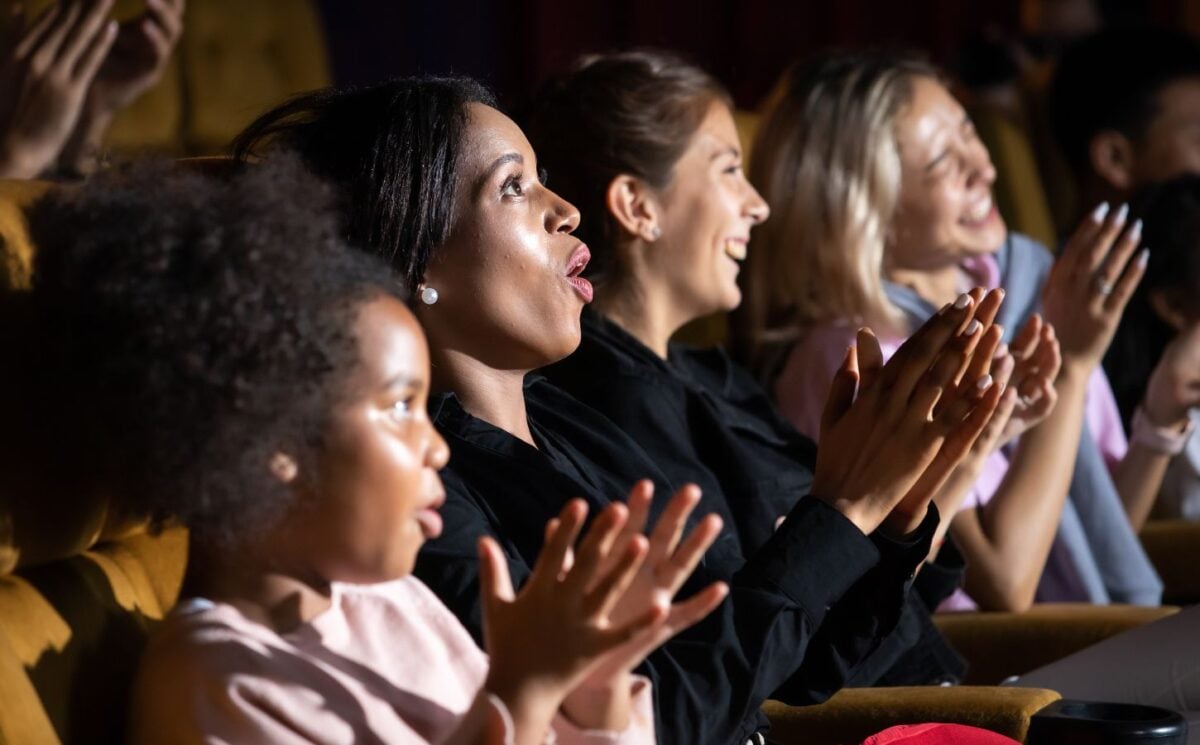 People in the audience at a theater