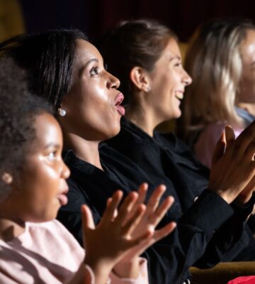 People in the audience at a theater