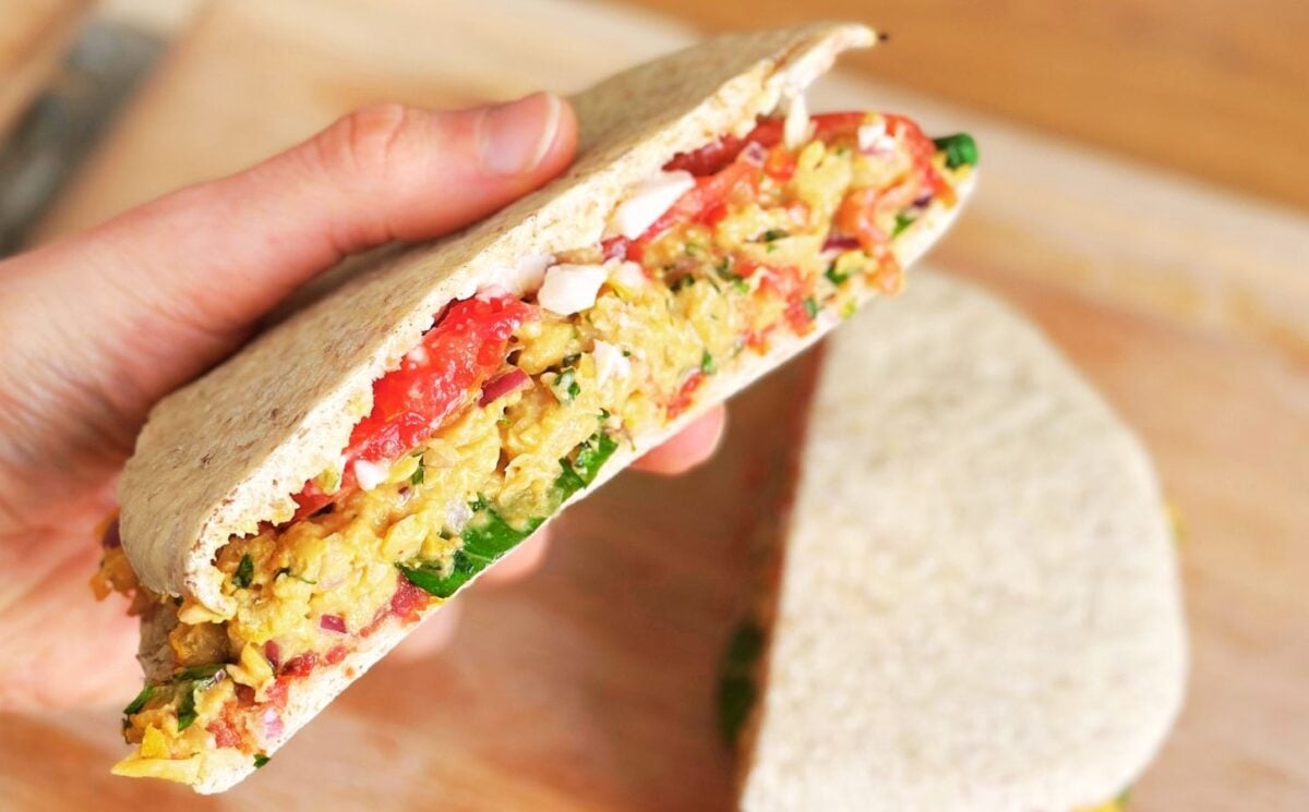 vegan chickpea sandwich plant-based pita sandwich with tomato and onion