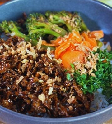 ground tofu bowl made with shredded teriyaki tofu, coconut rice, and broccoli