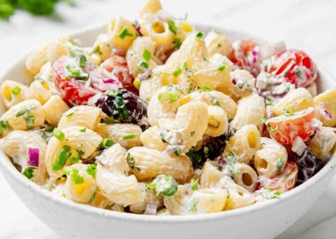 vegan summer macaroni pasta salad made with gluten-free pasta, classic flavors like tomato, parsley, olives, and vegan mayo or sour cream