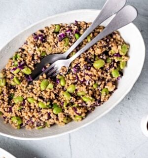 vegan easy quinoa and edamame salad made with cabbage, green onion, and sauce for a protein packed meal