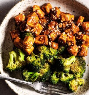 Sheet pan broccoli and tofu covered in a sticky sauce roasted in one pan