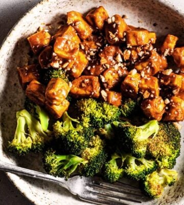 Sheet pan broccoli and tofu covered in a sticky sauce roasted in one pan