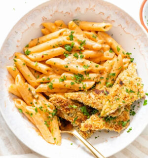 Photo shows a large white bowl of a vegan Cajun-style pasta recipe made with tempeh, a gut-friendly fermented food