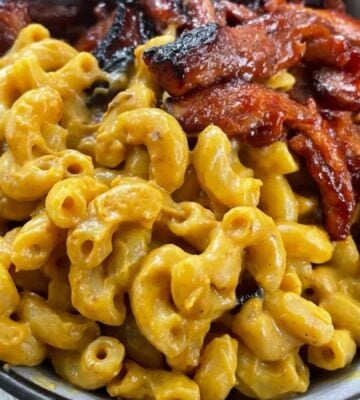 creamy vegan macaroni and plant-based cheese recipe with barbeque soy curls on the side