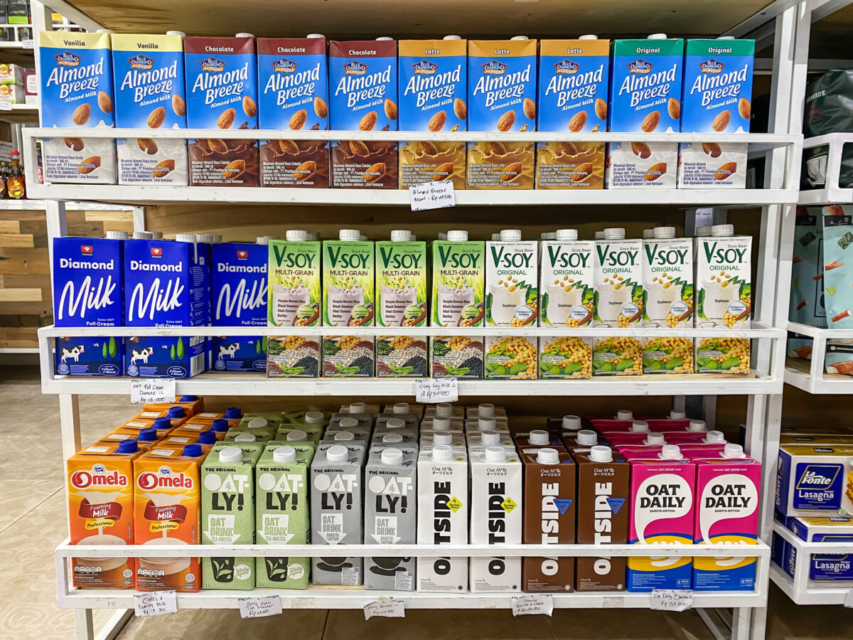 A collection of vegan non-dairy milks in a UK supermarket
