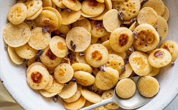 a bowl of vegan mini pancake cereal made with a dairy-free and egg-free recipe