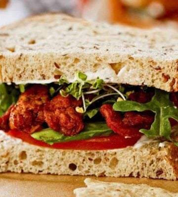 A vegan BLT sandwich made with soy curls and other plant-based ingredients