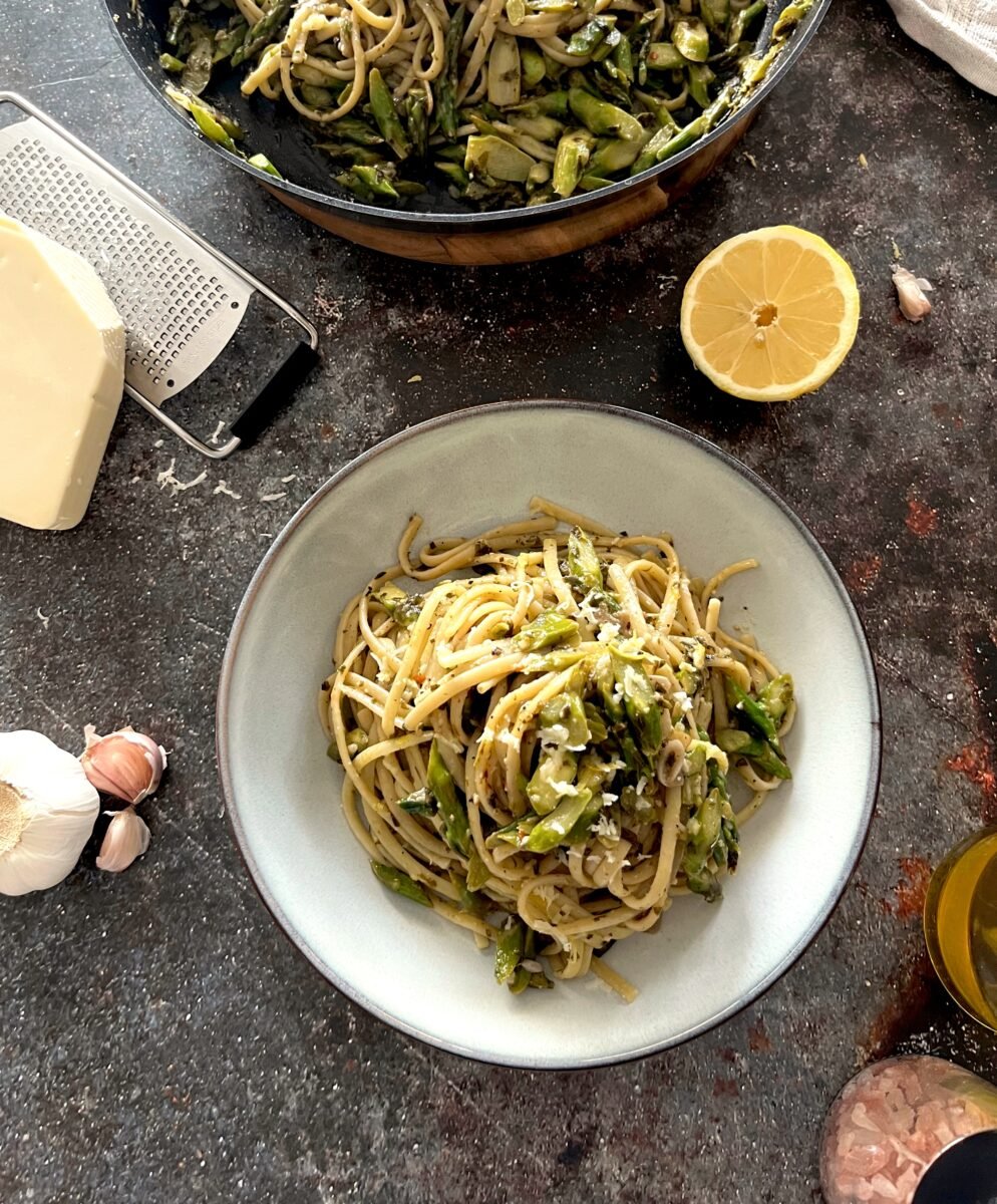 A bowl of plant-based and dairy-free vegan asparagus and pesto linguine