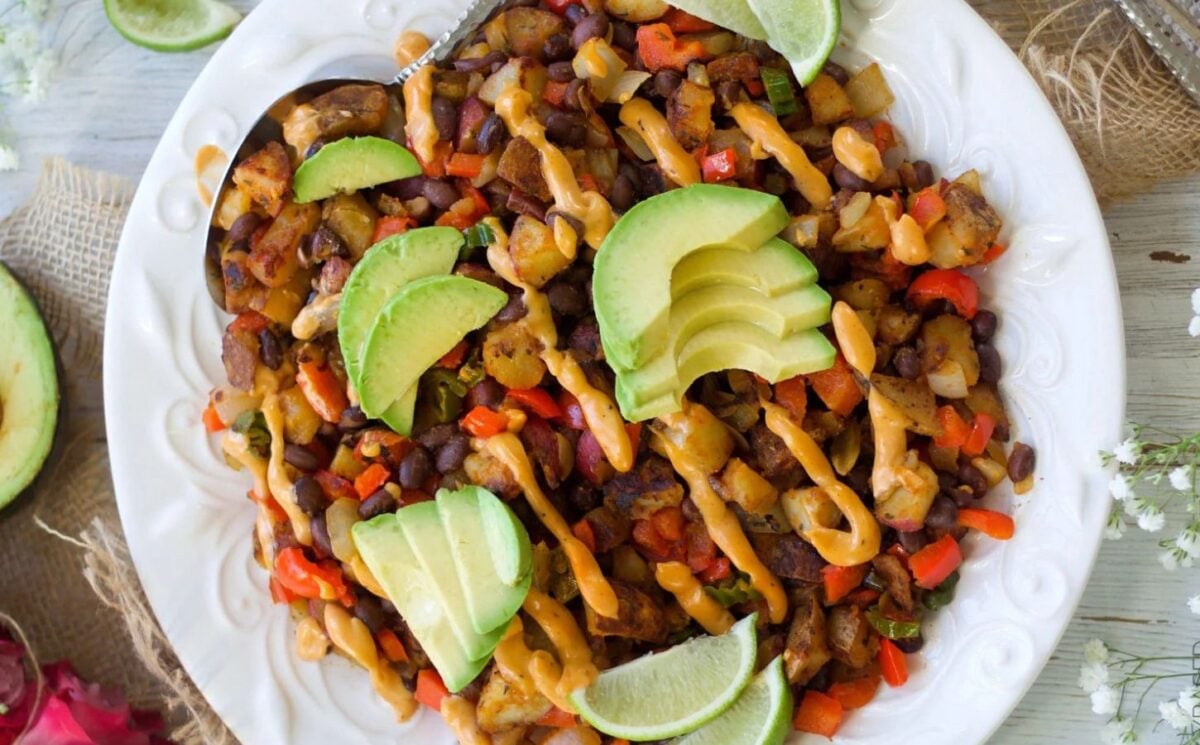 Photo shows a black bean breakfast hash on a white plate