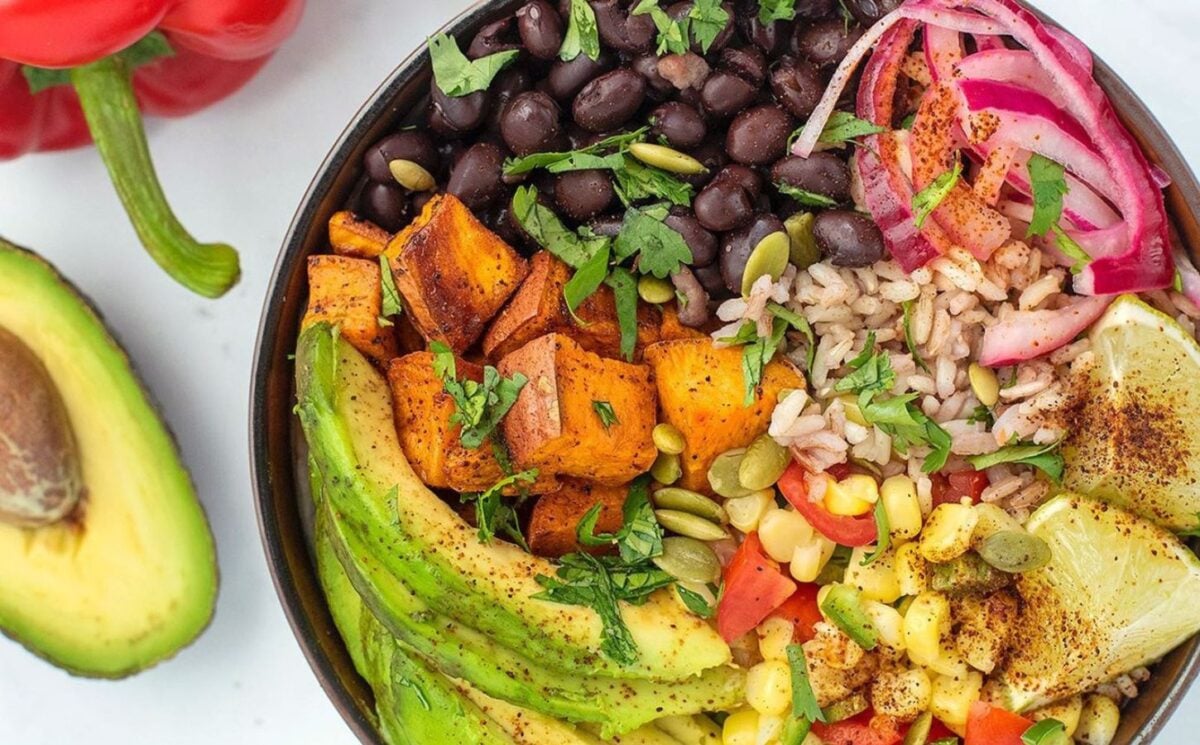 Photo shows a close-up of a burrito bowl recipe created by the Herbivore's Kitchen that includes black beans and sweet potato