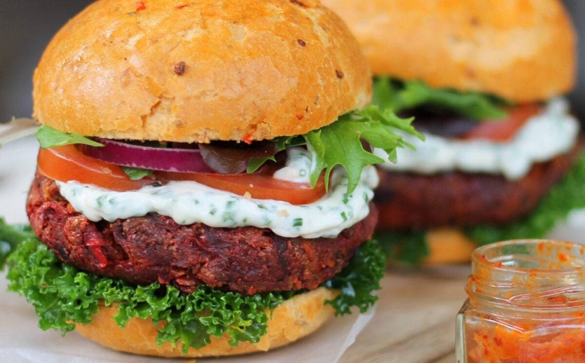 vegan carrot, beetroot, and cumin burgers made with chickpeas and topped with garnish of your choice