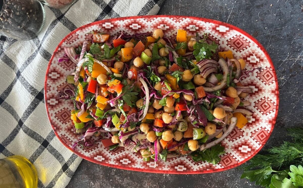 vegan, nut-free, gluten-free chickpea rainbow salad made with cucumber, cabbage, onion, bell peppers and a simple salad dressing