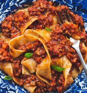 vegan classic Bolognese made with ragu-style tomato sauce and topped over pappardelle pasta