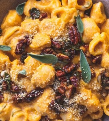 creamy pumpkin pasta made with maple sage and pecan crumble and vegan parmesan