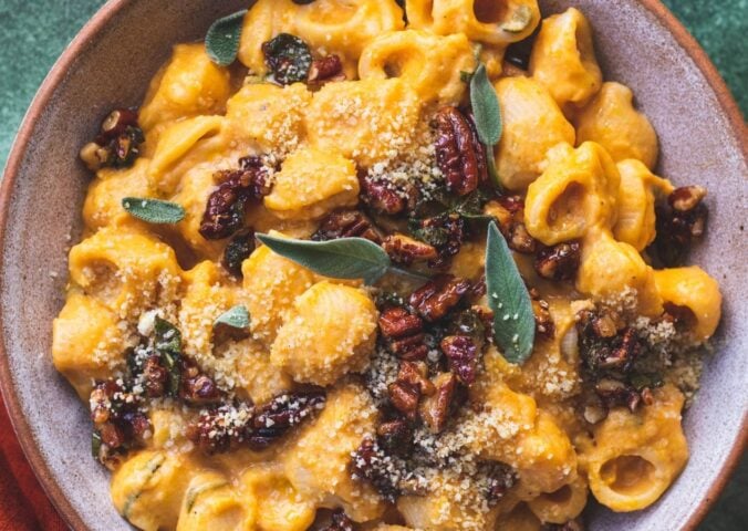 creamy pumpkin pasta made with maple sage and pecan crumble and vegan parmesan