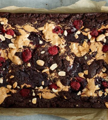 vegan chocolate brownies loaded with peanut butter and raspberry jam