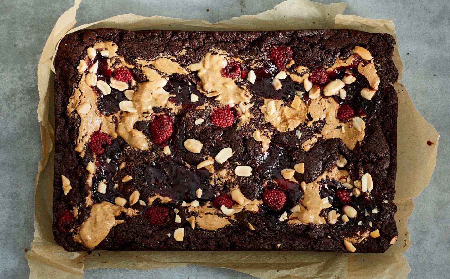 vegan chocolate brownies loaded with peanut butter and raspberry jam