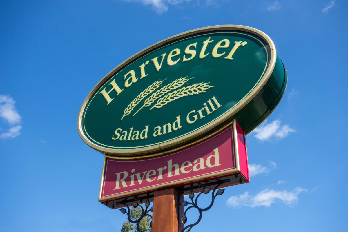 A sign for vegan-friendly UK restaurant Harvester