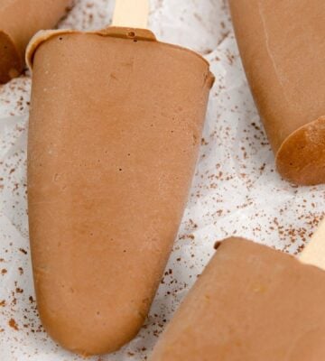 homemade vegan fudgesicles made with cocoa powder, nut butter, plant-based milk, and coconut sugar