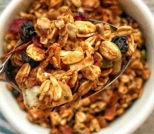no oil granola made with all vegan ingredients, coconut, flax, chia seeds, cranberries, dates, and mixed nuts