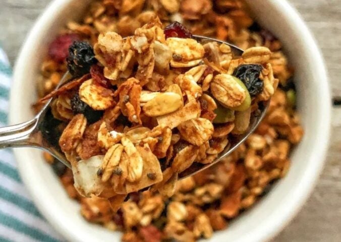 no oil granola made with all vegan ingredients, coconut, flax, chia seeds, cranberries, dates, and mixed nuts