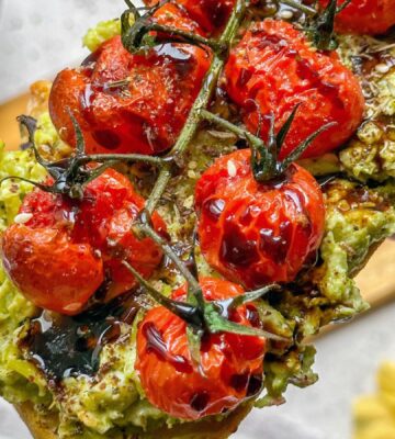 Peas on toast, an alternative to avo on toast, with roasted tomatoes on top