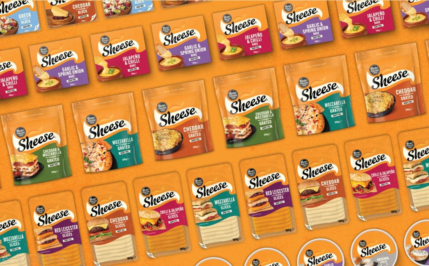 A selection of rebranded dairy-free cheese products from plant-based brand Sheese. The new products are orange in color with a new logo