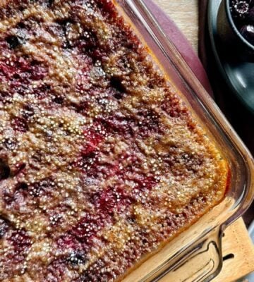 vegan quinoa sweet-berry bake made with chia seeds, blueberries, raspberries, blackberries, vanilla, maple syrup, and coconut milk and cream