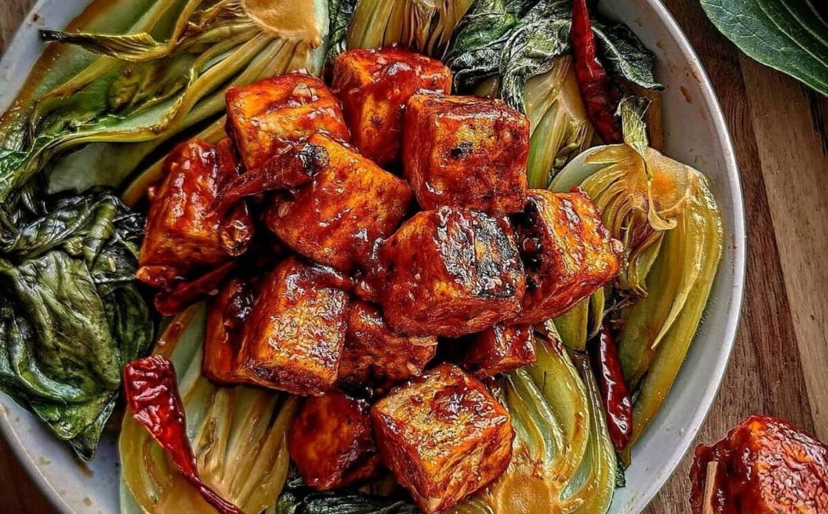 Photo shows a close up of sweet and sour tofu and bok choy