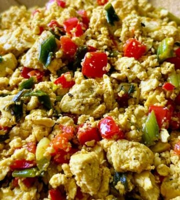 tofu breakfast scramble made with Himalayan black salt, turmeric, bell peppers, and onions