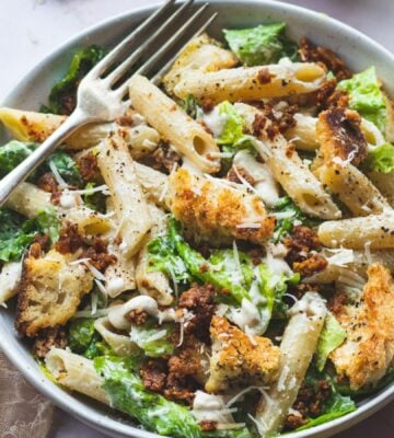 A bowl of vegan pasta caesar salad made to a dairy-free recipe