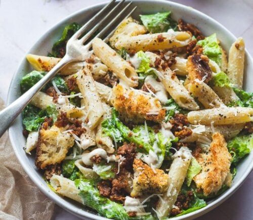 A bowl of vegan pasta caesar salad made to a dairy-free recipe