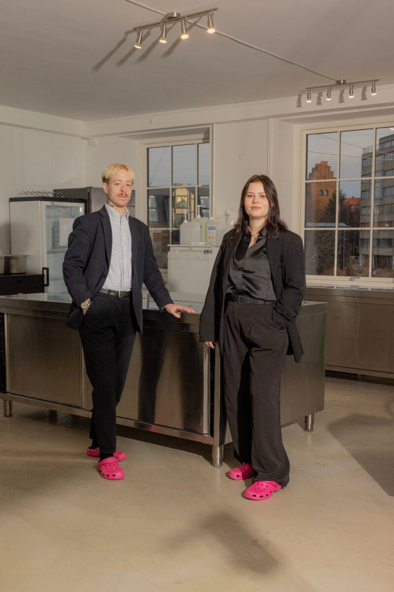 Two workers at fermented vegan cheese company FÆRM standing in a kitchen