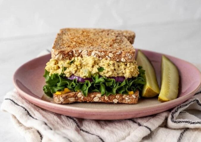 A vegan egg salad sandwich made to a plant-based and egg-free recipe
