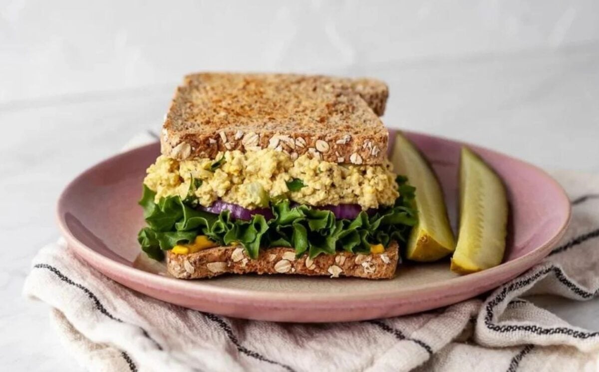 Photo shows a vegan egg salad sandwich plated up