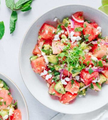 A vegan watermelon salad with mint, avocado, and dairy-free feta cheese