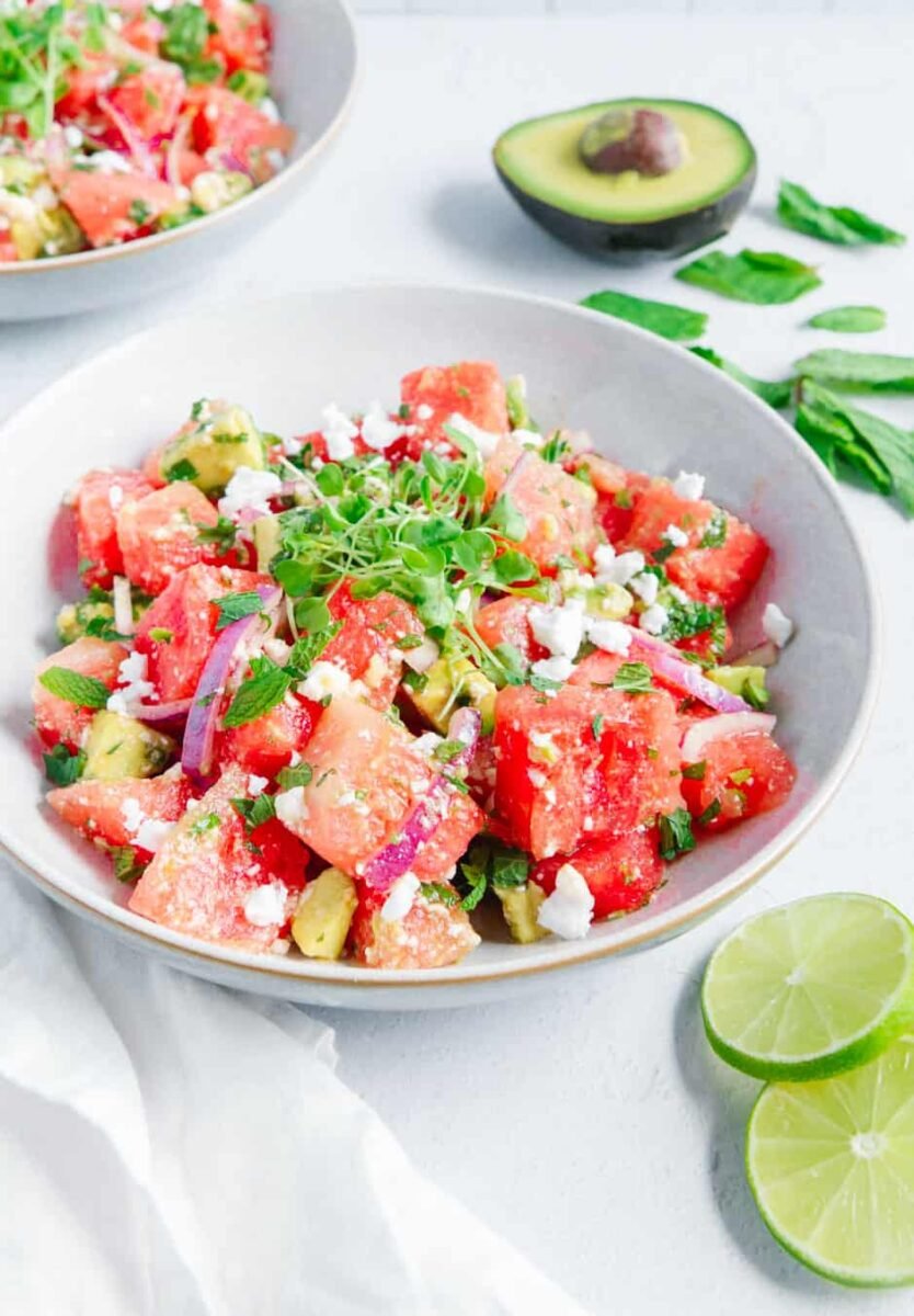 A vegan watermelon salad with mint, avocado, and dairy-free feta cheese