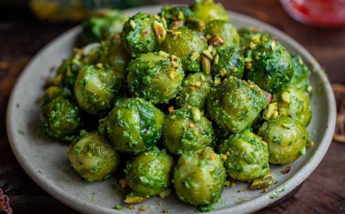 Photo shows a plate piled high with pesto-flavored Brussels sprouts