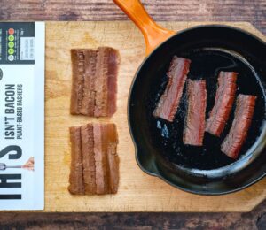 A pan of plant-based bacon from vegan meat brand THIS