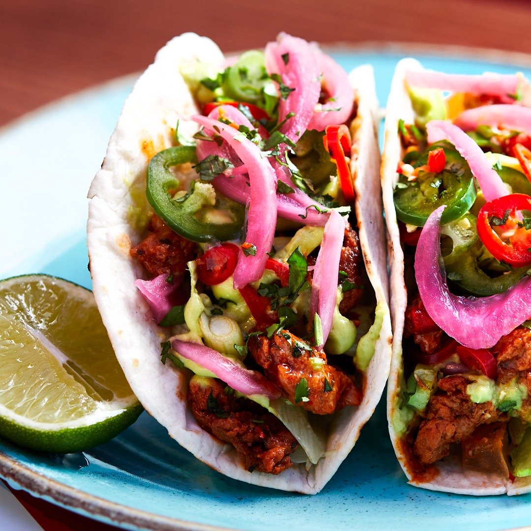 Photo shows a plate of TGI Fridays tacos made with Meatless Farm's vegan meat