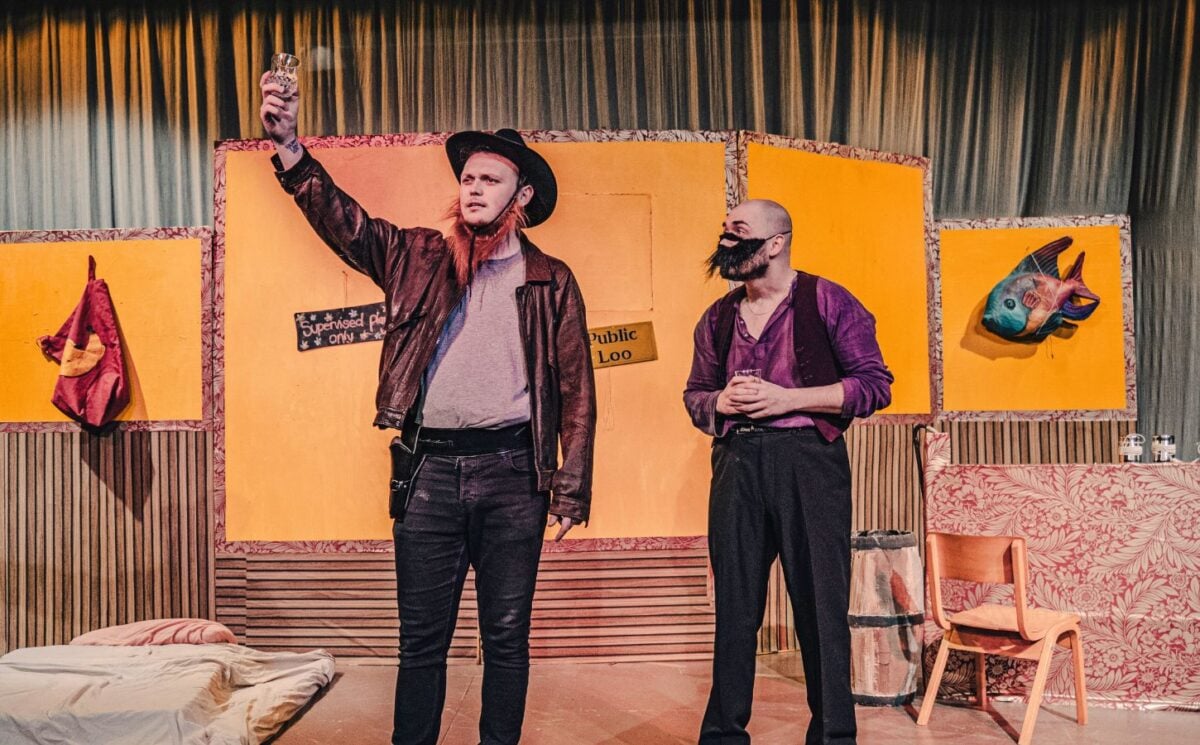 Two actors on stage at a meat industry play at the UK's first vegan theater