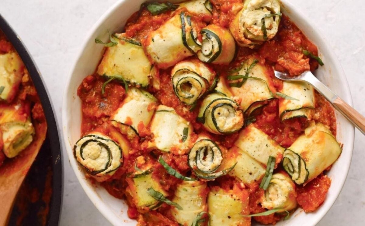 Vegan ricotta zucchini balls that are dairy-free and in a tomato sauce
