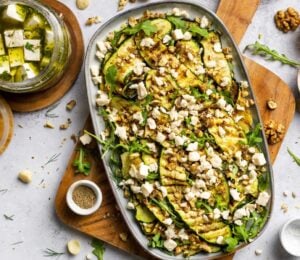 A large plate of zucchini salad made with macadamia nut-based dairy-free feta
