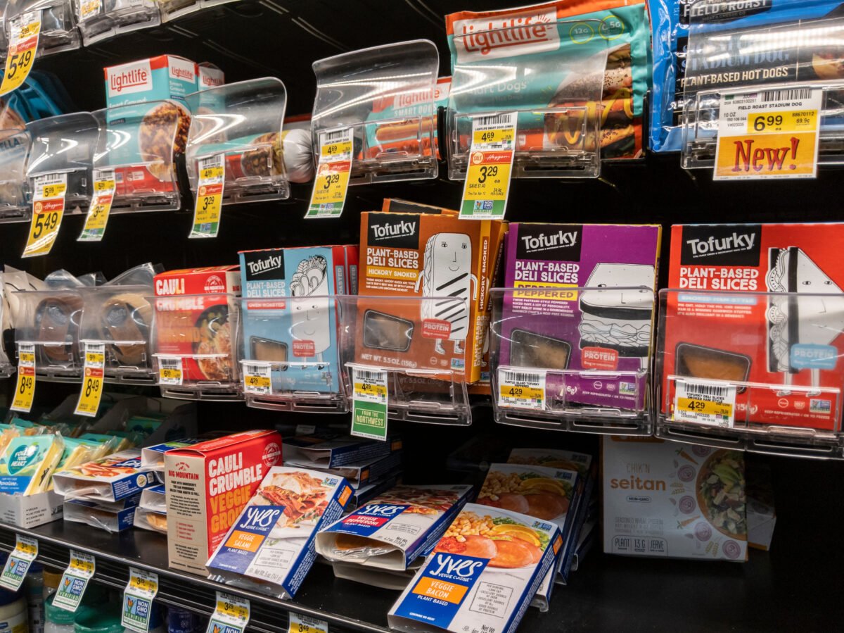 Photo shows a selection of plant-based meat products on supermarket shelves