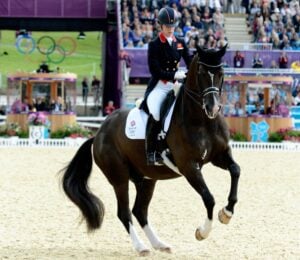 Dressage Olympian Charlotte Dujardin on a horse at the Olympics
