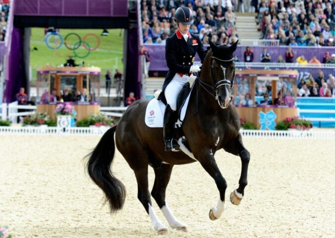 Dressage Olympian Charlotte Dujardin on a horse at the Olympics